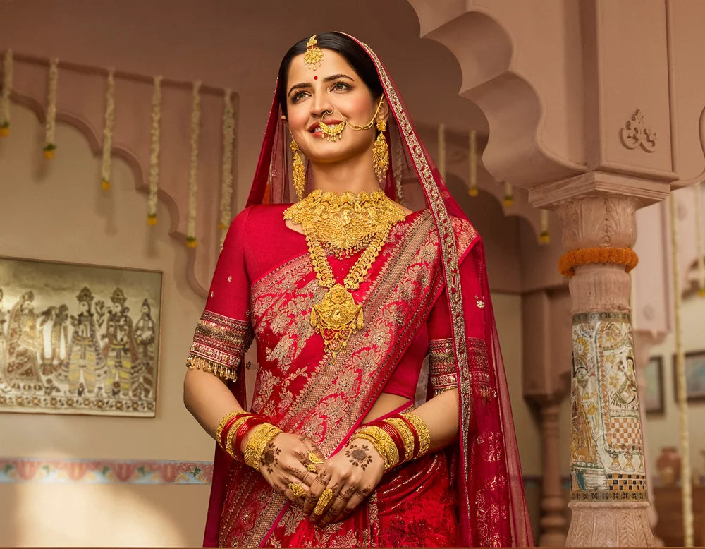 Traditional Indriya bridal jewellery, worn with a red sari