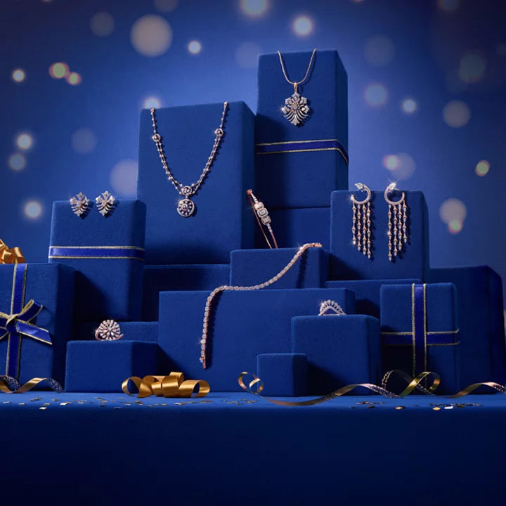 Indriya jewellery arranged on blue gift boxes